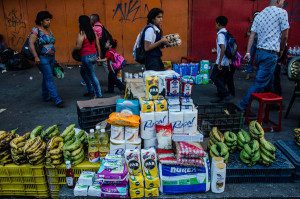 The black market in the Petare barrio of Caracas. Credit Meridith Kohut for The New York Times